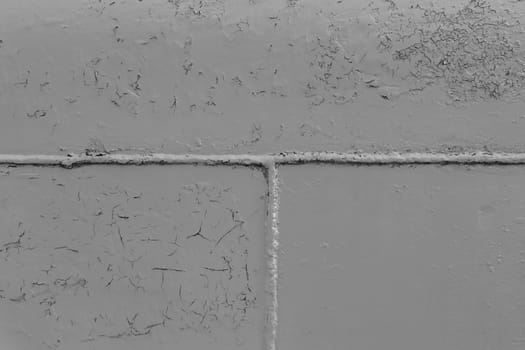 Gray metal surface with a weld seam. Grey grunge metal textured wall background