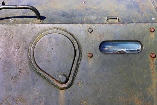 Old military vehicle door, detail of old military vehicle, closeup of photo