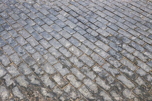 Old cobblestone street, cobblestone, tiled floor, pavement ground texture.. old tiles.