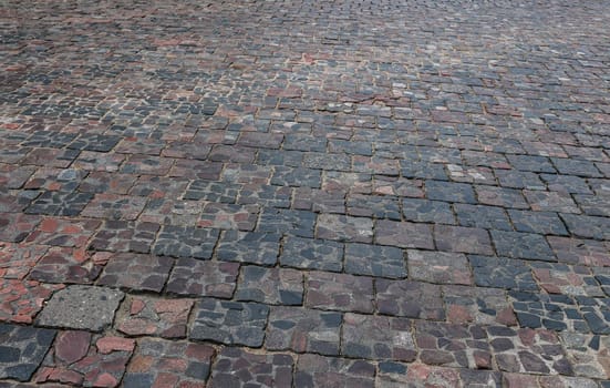 Old cobblestone street, cobblestones, tiled floor, pavement texture.