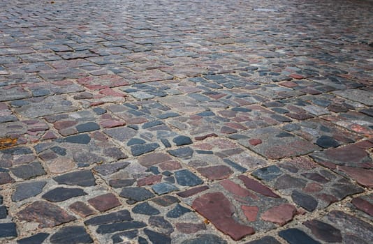 Old cobblestone street, cobblestones, tiled floor, pavement texture.