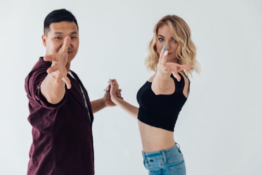 a man and a woman reach out their hands Dance partners call to the studio