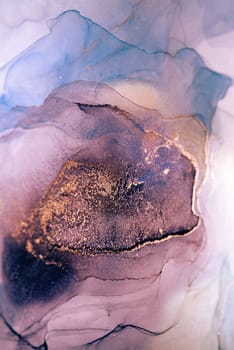 A close-up image of an abstract art piece created using ink and water. The image features swirling patterns of lavender, blue, and gold ink.