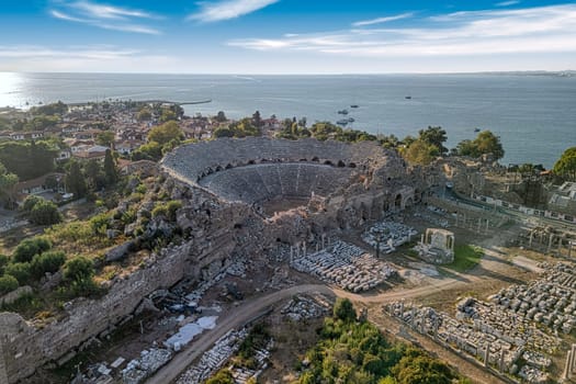 Aerial top drone view of the ancient city of Side with its Amphitheatre, Antalya province in Turkey.