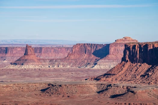 Stunning panoramic view from the iconic Grand View Point in Canyonlands National Park, Utah. The photo captures the majestic red rock formations and western landscape under a blue sky - USA