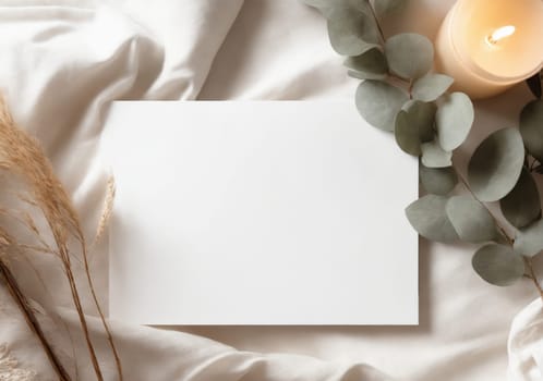 Flatlay with white empty sheet copy space for text, mock up. White greeting card of paper and cozy items background. Top view. Copy space for text or design