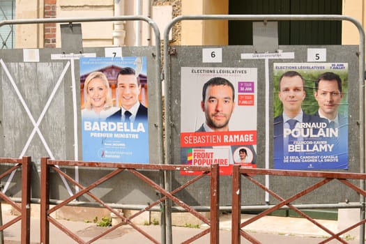 VERSAILLES, FRANCE - JUNE 26, 2024 : The banners with candidates for elections legislative