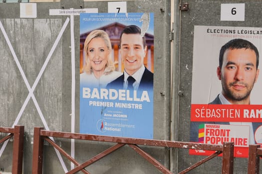 VERSAILLES, FRANCE - JUNE 26, 2024 : The banners with candidates for elections legislative