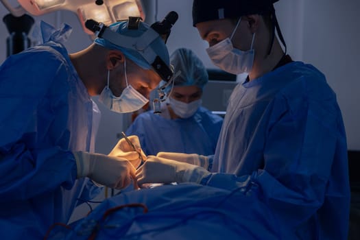 Blepharoplasty, plastic surgery to correct defects of the eyelids and eyes to aesthetically modify the eye area. removal of fat deposits, in a medical clinic, a surgical team performs an operation
