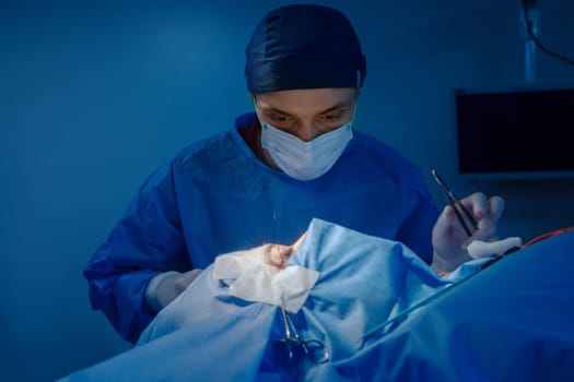 Blepharoplasty, plastic surgery to correct defects of the eyelids and eyes to aesthetically modify the eye area. removal of fat deposits, in a medical clinic, a surgical team performs an operation