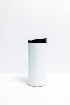 Isolated Metal Coffee Travel Mug On White Background. Thermal Cup For Beverage Or Drinks, Vertical Plane, Copy Space. Stainless Steel Thermos. Backdrop High quality photo