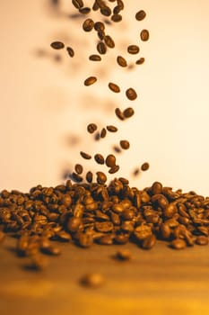 Roasted coffee beans flying in the air. Background for coffee.