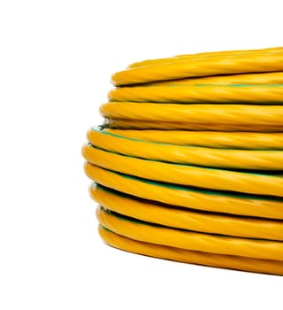 This image shows a close-up view of a coiled electrical cable. The cable is yellow with a green stripe running down the center.