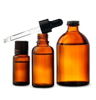 This image showcases three amber glass dropper bottles with a single glass dropper laying across the bottles.