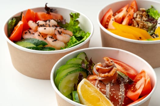 Tasty take out poke bowls isolated on white background close up
