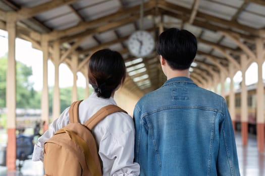 A young couple traveling on a train trip, sharing a moment of togetherness and adventure as they explore new destinations.