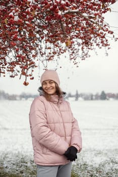 Winter Elegance: Portrait of a Beautiful Girl in a Snowy European Village