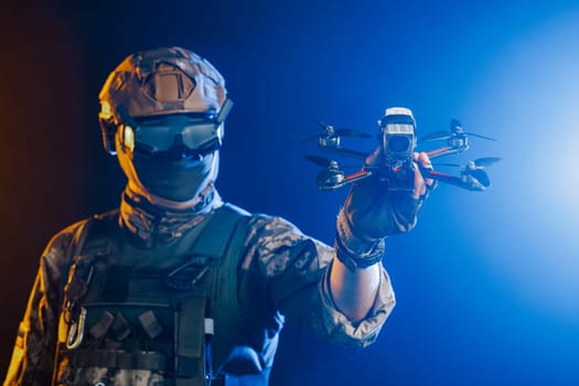 Soldier in gear holds drone against a red and blue smoky background, conveying intensity and military action