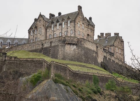 Edinburgh, Scotland - Jan 16, 2024 - Scenic view of Edinburgh Castle at the top of the hill is a historic fortress and is one of the most popular tourist attractions in Edinburgh city. Space for text, Selective focus.