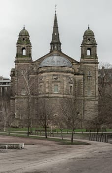 Edinburgh, Scotland - Jan 16, 2024 - Exterior view of The ancient Parish Church of St Cuthbert is situated within a large churchyard that bounds Princes Street Gardens in the centre of Edinburgh. Space for text, Selective focus.