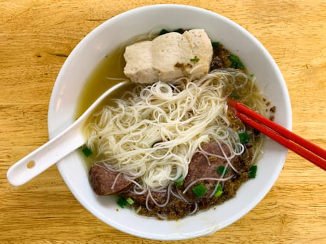 Top view of delicious Pork Soup Noodle. Asian food concept.