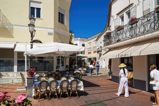Anacapri, Italy Diaz square with outdoor seating area and walking crowd in Capri Island.