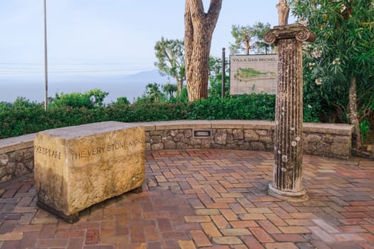 Anacapri, Italy marble stone with the curved message “the very stone kicks” at Capri Island.