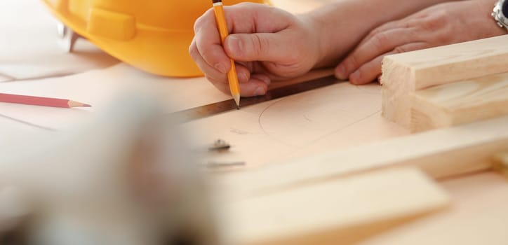 Arms of worker measuring wooden bar portrait. Manual job DIY inspiration improvement job fix shop yellow helmet joinery startup workplace idea hard hat career ruler industrial education