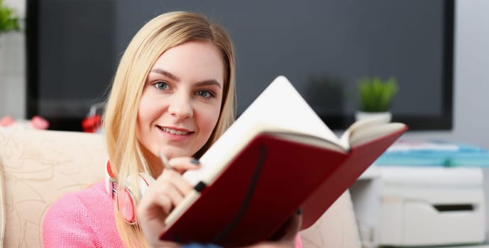 young beautiful woman fill in your personal diary bright impressions concept