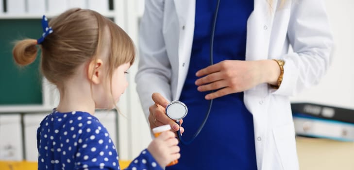 Little child with stethoscope at doctor reception. Physical exam cute infant portrait baby aid healthy lifestyle ward round child sickness specialist clinic test pulse concept