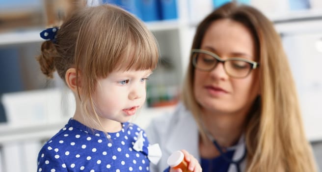 Little child with mother at pediatrician reception. Physical exam cute infant portrait baby aid healthy lifestyle ward round child sickness clinic test high quality and baby concept