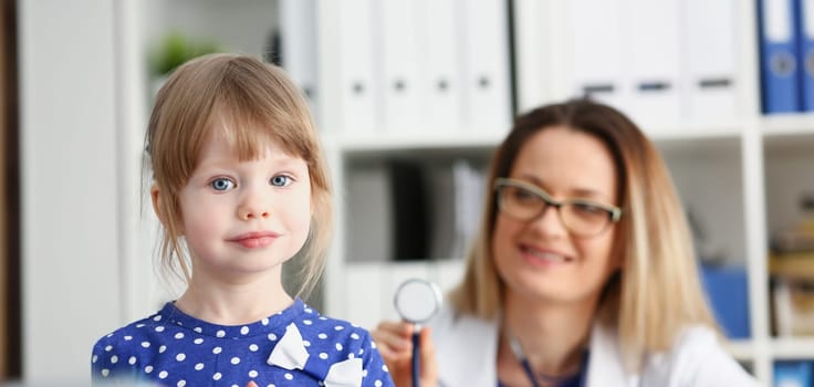 Little child with stethoscope at doctor reception. Physical exam cute infant portrait baby aid healthy lifestyle ward round child sickness specialist clinic test pulse concept