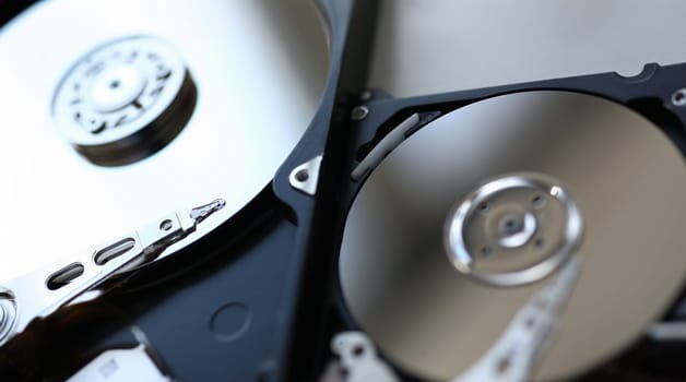 Hard drive from computer or laptop lies on the table in the repair shop. Performs fault diagnostics and performs urgent repairs recovery of lost data during deletion HDD closeup