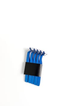 Mockup Isolated Set of Disposable Blue Plastic Razors On White Background, Copy Space, Vertical Plane. Personal Daily Hygiene. Blue Shaver For Man. Selective Focus. Removal Of Unwanted Hair. Package