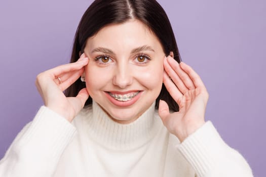 portrait of a girl with braces close-up, woman is happy with braces, beautiful teeth concept