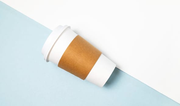 Mockup Paper Drinks Mug, Cup with White Lid and Corrugated Sleeve On White and Blue Background. Eco Hot Beverage Tumbler, Horizontal Plane, Copy Space. On the Go Food Service Application.