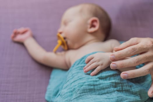 The baby is sleeping peacefully in his cozy nest. Newborn photo session captures the serene innocence and warmth of early moments.
