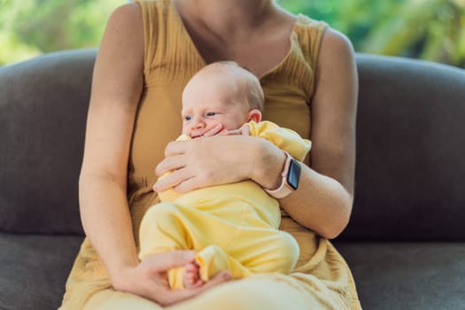 Mom with newborn baby relaxing on the sofa at home. This tender moment highlights the bond between mother and child in a comfortable and loving family environment.