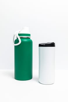 Isolated Reusable Sport Green and Water Bottles, Protein Shaker On White Background. Tumbler, Product Template. Travel Hiking Mug Vertical Plane. High quality photo