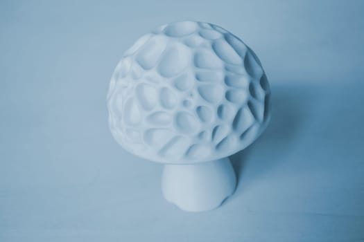 Object in the form of mushroom of white color printed on a 3D printer. Three-dimensional model printed on a 3D printer from molten plastic of red color. Concept 3D Printing. FDM 3D Printing technology