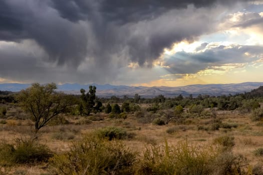 Stunning sunset paints the sky in vibrant hues over Alpana Station in the Flinders Ranges landscape.