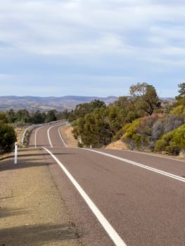 Flinders Ranges Way stretches through the picturesque Ikara-Flinders Ranges, offering breathtaking views of the rugged terrain.