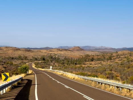 Flinders Ranges Way stretches through the picturesque Ikara-Flinders Ranges, offering breathtaking views of the rugged terrain.