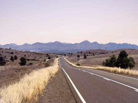 Flinders Ranges Way stretches through the picturesque Ikara-Flinders Ranges, offering breathtaking views of the rugged terrain.