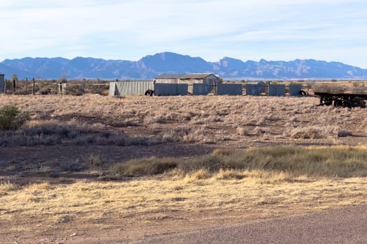 Weathered sheds at Parachilna with the rugged Ikara-Flinders Ranges in the background.