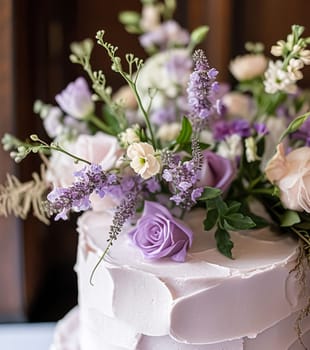 Wedding cake with lavender flowers. Festive table decoration.