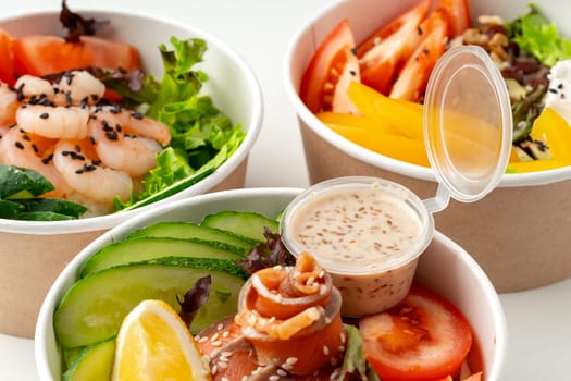 Tasty take out poke bowls isolated on white background close up