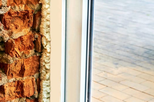 an opening in the wall or roof of a building that is fitted with glass