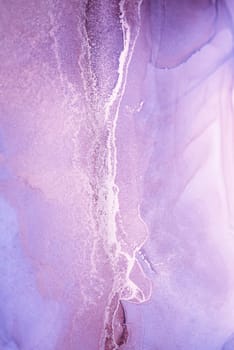 A close-up abstract image featuring a vibrant lavender background with swirling patterns of silver metallic paint.