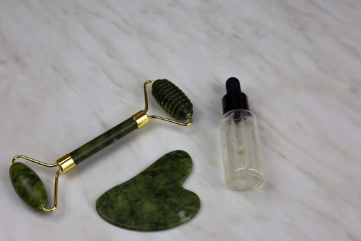 Skin care kit, gua sha scraper and roller to smooth out wrinkles and maintain healthy skin with special oil to moisturize the body